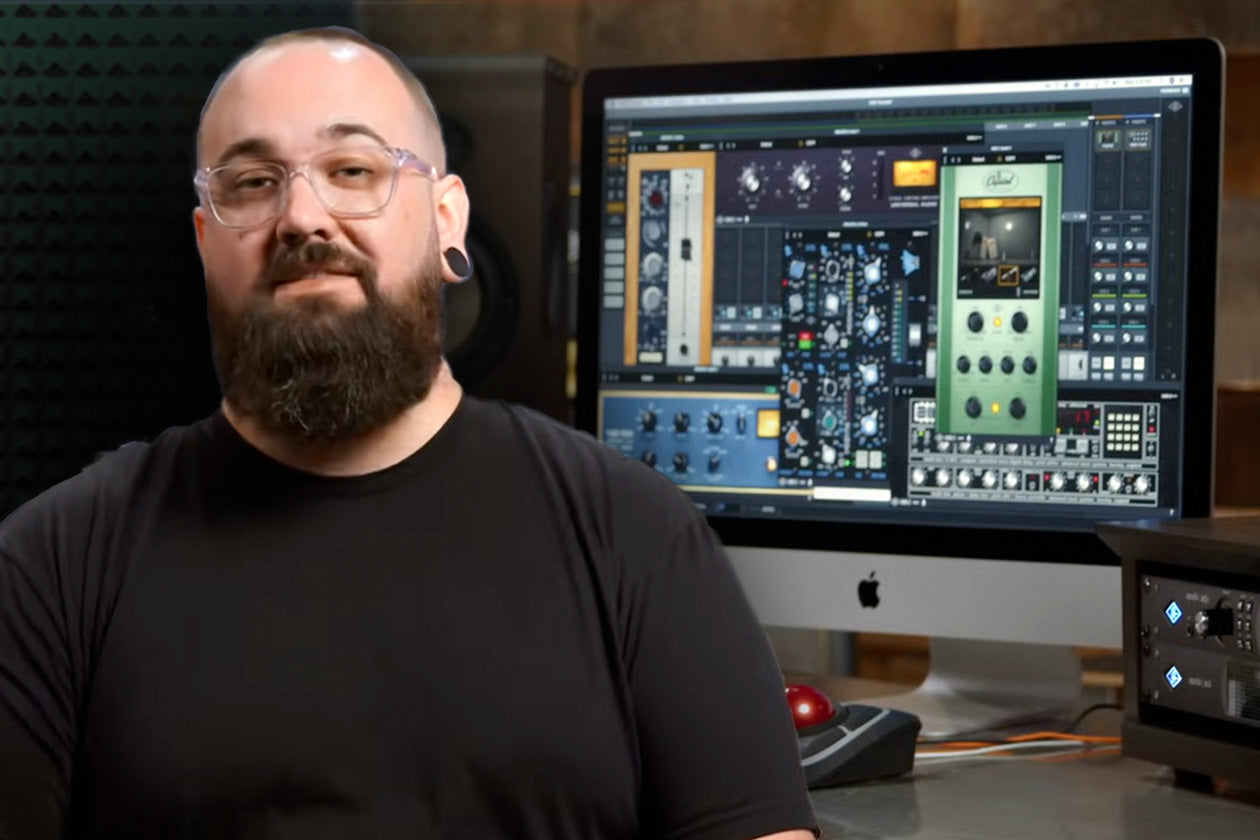 Universal Audio's Matt Petersen sits in front of a computer monitor with many plug-ins 