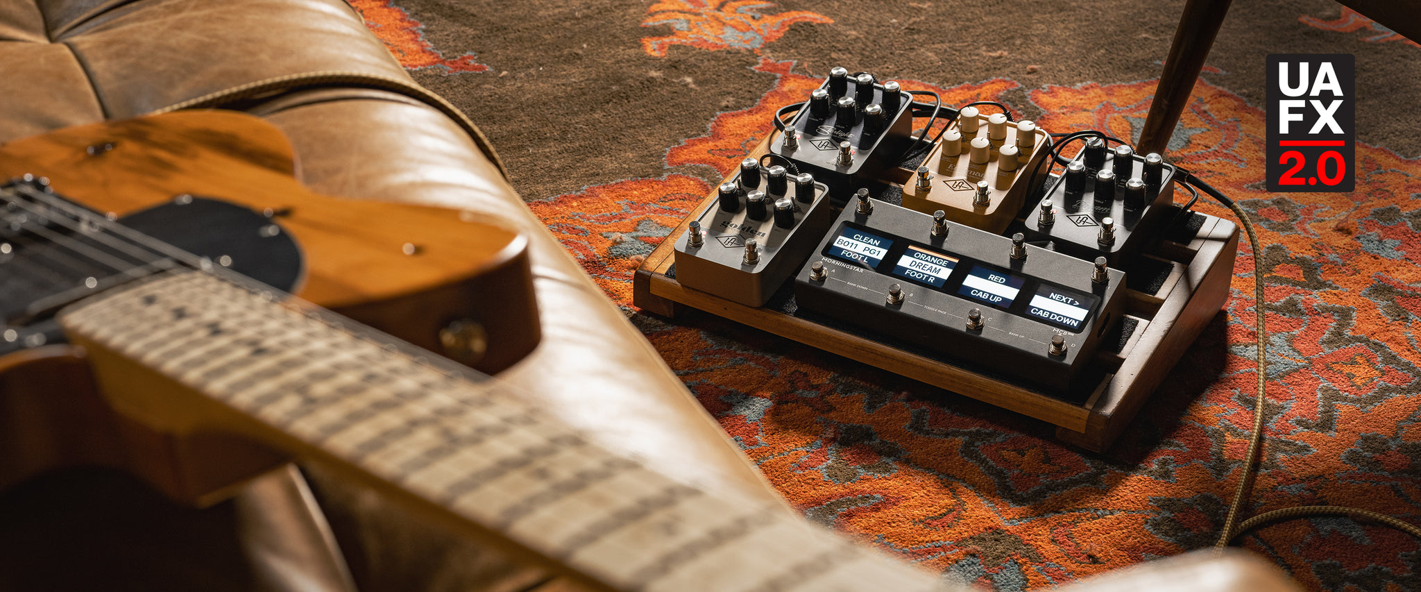 Telecaster and pedal board with UAFX pedals and midi controller
