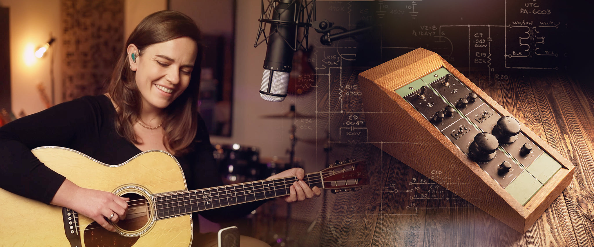 Mary Spender plays guitar and sings with a pair of microphones, with a UA 610 tube preamp off to the side
